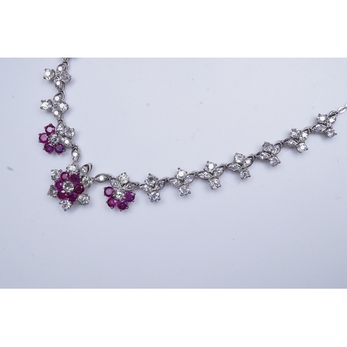 383 - A ruby and diamond necklace the front composed of floral links set with antique circular-cut and sin... 