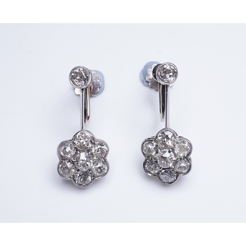 384 - A pair of diamond earrings, early 20th century each composed of a surmount suspending a floral clust... 