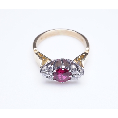 386 - A synthetic ruby and diamond ring, claw-set with a circular-cut synthetic ruby between shoulders set... 