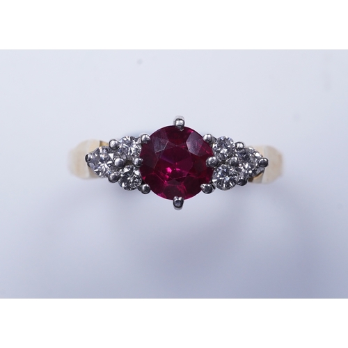 386 - A synthetic ruby and diamond ring, claw-set with a circular-cut synthetic ruby between shoulders set... 