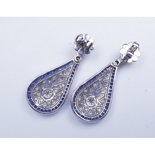 388 - A pair of sapphire and diamond earrings each designed in the Edwardian style, the foliate surmounts ... 