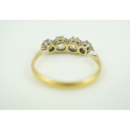 389 - A four-stone diamond ring, early 20th century, claw-set with four antique circular-cut diamonds tota... 