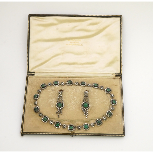 392 - An emerald and rock crystal demi-parure, France, early 20th century, comprising: a necklace, compose... 