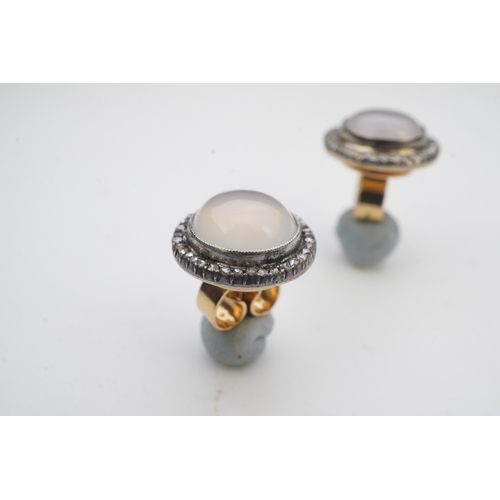 393 - A pair of chalcedony and diamond earrings, each of cluster design, millegrain-set with a cabochon of... 