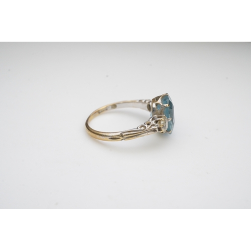 399 - An aquamarine and diamond ring, early 20th century, claw-set with a cushion-shaped aquamarine betwee... 