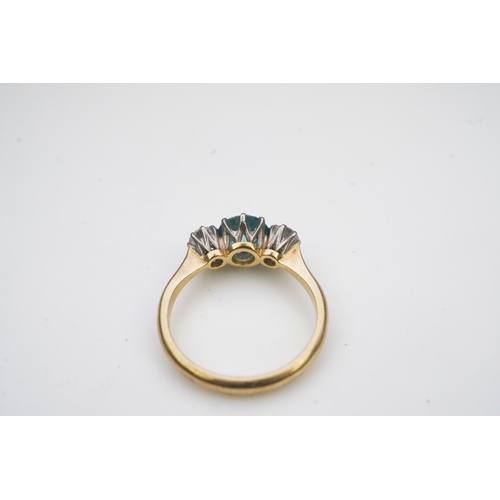 400 - A zircon and diamond ring, claw-set with a brilliant-cut blue zircon, between shoulders set with bri... 