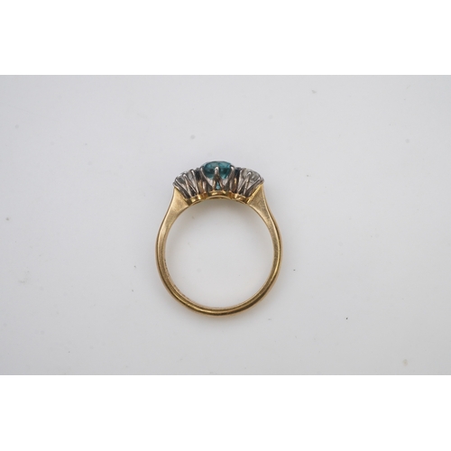 400 - A zircon and diamond ring, claw-set with a brilliant-cut blue zircon, between shoulders set with bri... 