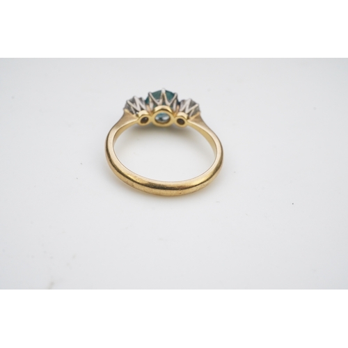 400 - A zircon and diamond ring, claw-set with a brilliant-cut blue zircon, between shoulders set with bri... 