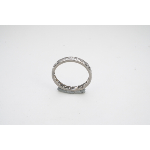 401 - A diamond eternity ring, mid 20th century, set with a continuous band of single-cut diamonds totalli... 