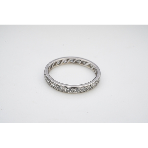 401 - A diamond eternity ring, mid 20th century, set with a continuous band of single-cut diamonds totalli... 