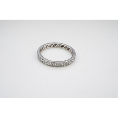 401 - A diamond eternity ring, mid 20th century, set with a continuous band of single-cut diamonds totalli... 