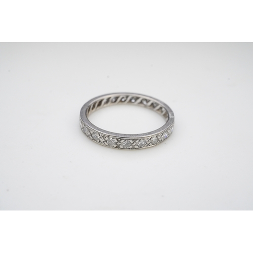 401 - A diamond eternity ring, mid 20th century, set with a continuous band of single-cut diamonds totalli... 