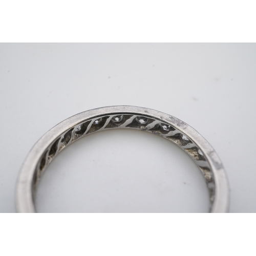 401 - A diamond eternity ring, mid 20th century, set with a continuous band of single-cut diamonds totalli... 