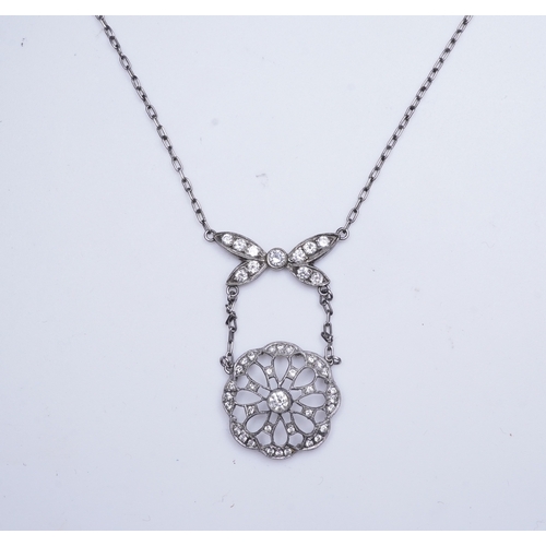 402 - A diamond pendant necklace, of Edwardian inspiration, designed as a bow suspending an openwork flora... 