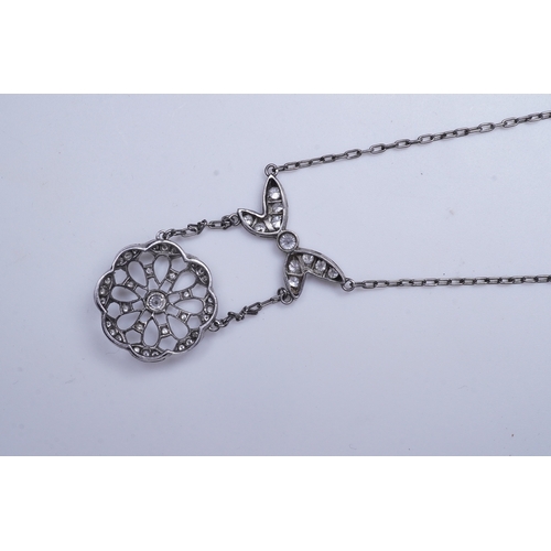 402 - A diamond pendant necklace, of Edwardian inspiration, designed as a bow suspending an openwork flora... 