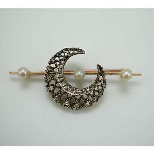 403 - An Edwardian pearl and diamond brooch, early 20th century, designed as a crescent moon set with cush... 