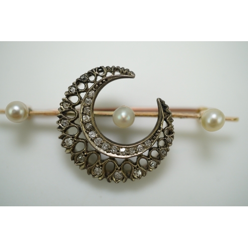 403 - An Edwardian pearl and diamond brooch, early 20th century, designed as a crescent moon set with cush... 