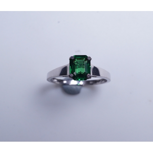 408 - A tsavorite garnet ring, claw-set with a step-cut tsavorite garnet weighing 1.16 carats, size N1/2, ... 