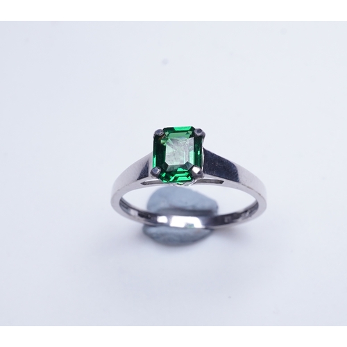 408 - A tsavorite garnet ring, claw-set with a step-cut tsavorite garnet weighing 1.16 carats, size N1/2, ... 