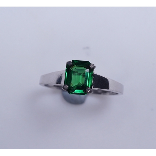 408 - A tsavorite garnet ring, claw-set with a step-cut tsavorite garnet weighing 1.16 carats, size N1/2, ... 