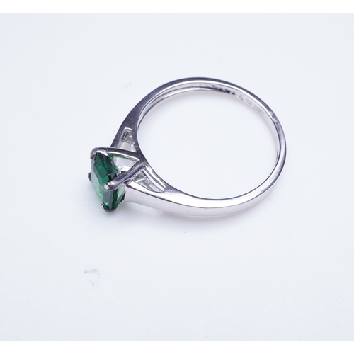 408 - A tsavorite garnet ring, claw-set with a step-cut tsavorite garnet weighing 1.16 carats, size N1/2, ... 