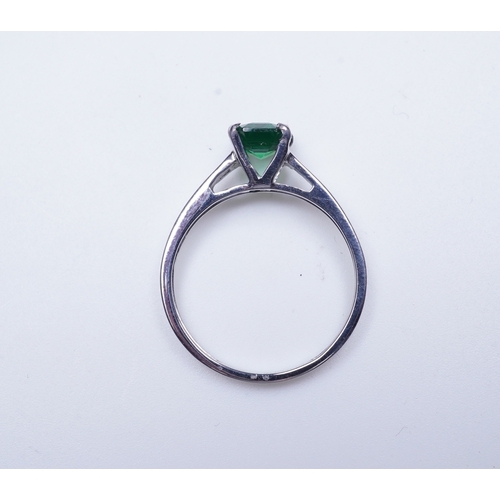 408 - A tsavorite garnet ring, claw-set with a step-cut tsavorite garnet weighing 1.16 carats, size N1/2, ... 