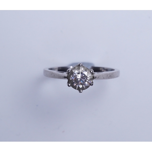 409 - A diamond solitaire ring, claw-set with a brilliant-cut diamond weighing approximately 0.60 carats, ... 