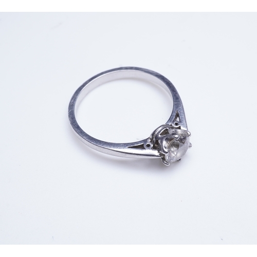 409 - A diamond solitaire ring, claw-set with a brilliant-cut diamond weighing approximately 0.60 carats, ... 