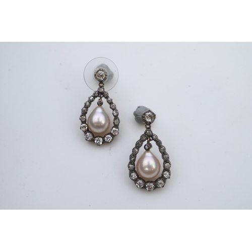 411 - A pair of cultured pearl and diamond earrings, each designed as a pear-shaped drop, suspending a cul... 