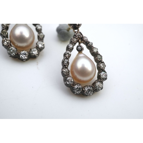 411 - A pair of cultured pearl and diamond earrings, each designed as a pear-shaped drop, suspending a cul... 