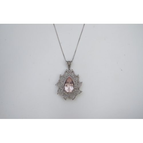 412 - A morganite and diamond pendant, set with a pear-shaped morganite weighing 8.80 carats, within a fol... 