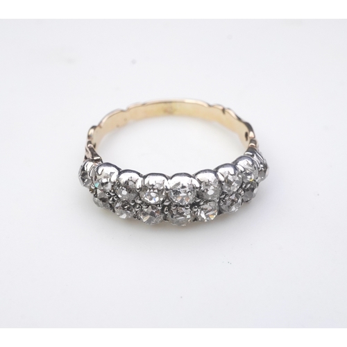 416 - A Georgian diamond ring, circa 1810, set with two rows of circular-cut diamonds totalling approximat... 