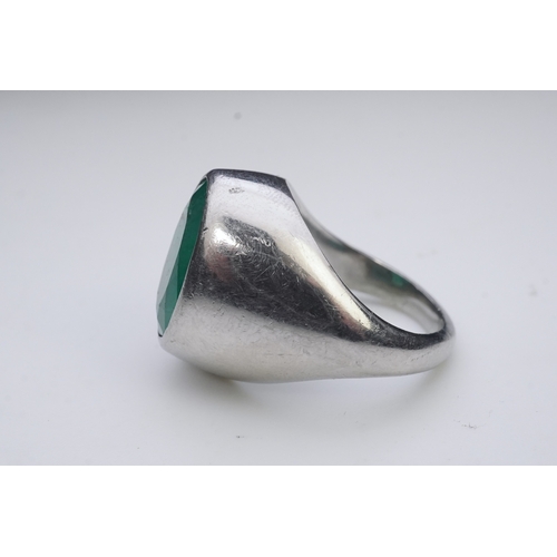 418 - An emerald signet ring, rubover set with an oval emerald measuring approximately 15.7mm x 10.9mm x 7... 