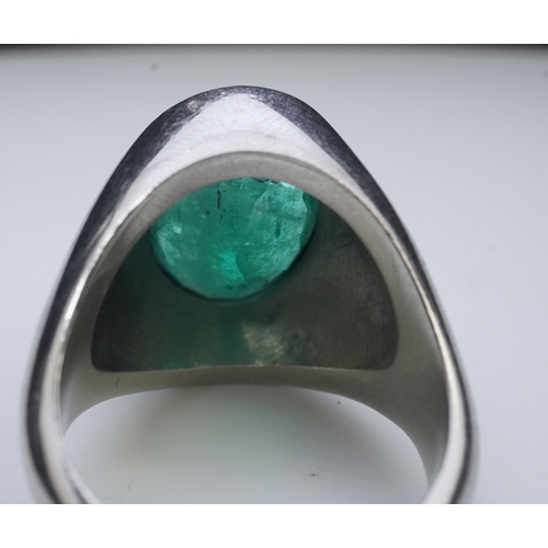 418 - An emerald signet ring, rubover set with an oval emerald measuring approximately 15.7mm x 10.9mm x 7... 