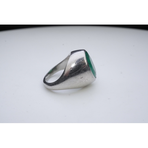 418 - An emerald signet ring, rubover set with an oval emerald measuring approximately 15.7mm x 10.9mm x 7... 