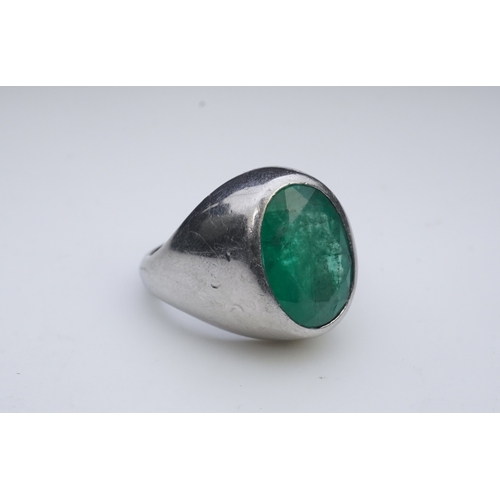 418 - An emerald signet ring, rubover set with an oval emerald measuring approximately 15.7mm x 10.9mm x 7... 