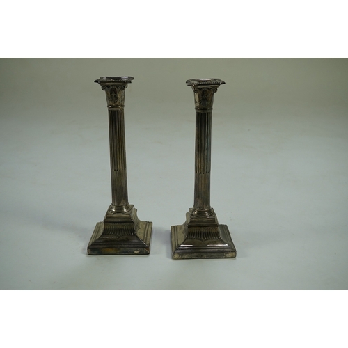 42 - A pair of Victorian silver fluted column candlesticks, by Thomas Bradbury & Sons, with beaded sconce... 