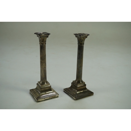 42 - A pair of Victorian silver fluted column candlesticks, by Thomas Bradbury & Sons, with beaded sconce... 