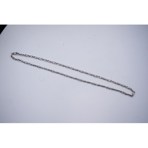 420 - A white gold and diamond necklace, composed of fancy linking, set with brilliant-cut diamonds totall... 