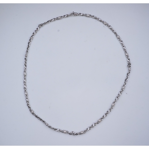 420 - A white gold and diamond necklace, composed of fancy linking, set with brilliant-cut diamonds totall... 