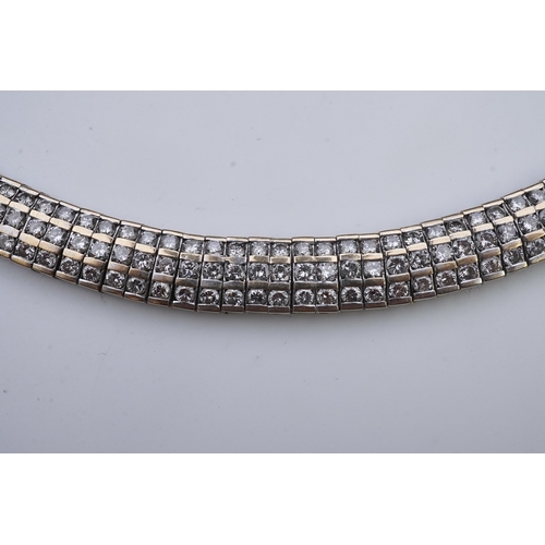 422 - A diamond bracelet, composed of links set with three rows of brilliant-cut diamonds totalling approx... 