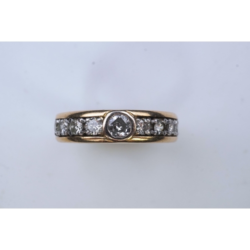 425 - A diamond eternity ring, centring on a circular-cut diamond weighing approximately 0.25 carats, to a... 