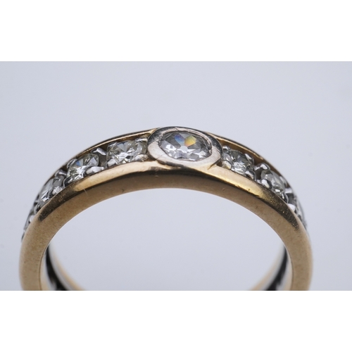 425 - A diamond eternity ring, centring on a circular-cut diamond weighing approximately 0.25 carats, to a... 