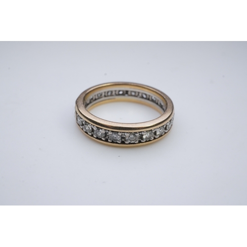 425 - A diamond eternity ring, centring on a circular-cut diamond weighing approximately 0.25 carats, to a... 