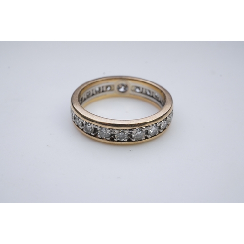 425 - A diamond eternity ring, centring on a circular-cut diamond weighing approximately 0.25 carats, to a... 