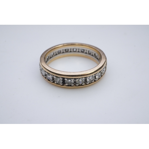 425 - A diamond eternity ring, centring on a circular-cut diamond weighing approximately 0.25 carats, to a... 