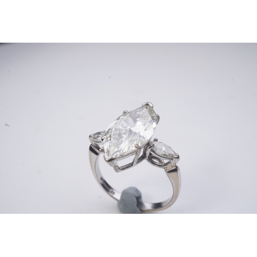 431 - An impressive diamond ring, set with a marquise-shaped diamond weighing 4.79 carats, to shoulders se... 