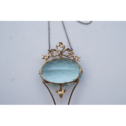 434 - An Edwardian aquamarine and diamond pendant necklace, early 20th century, composed of an oval aquama... 