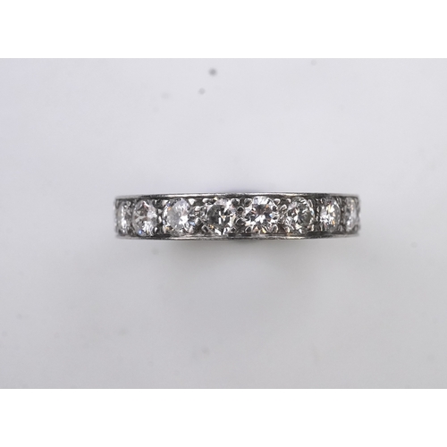 438 - A diamond eternity ring, set with a continuous line of brilliant-cut diamonds totalling approximatel... 