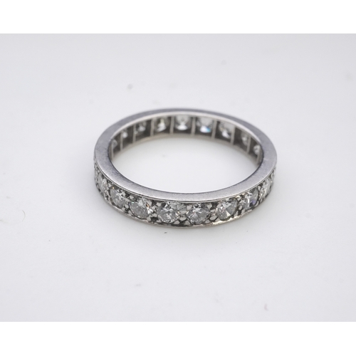 438 - A diamond eternity ring, set with a continuous line of brilliant-cut diamonds totalling approximatel... 